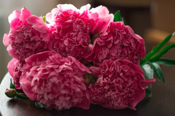 bouquet of pink peonies on the table