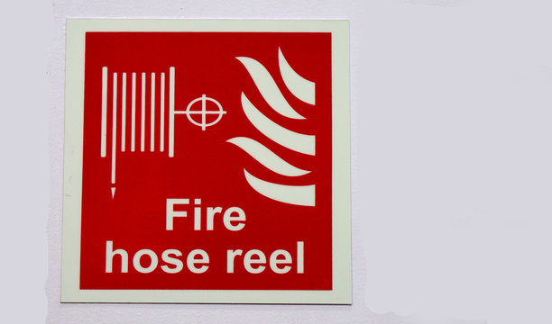 Fire hose reel sign,in fire emergency situation,in a public place              