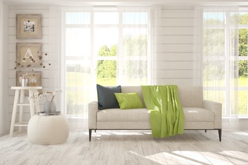 Stylish room in white color with sofa and summer landscape in window. Scandinavian interior design. 3D illustration