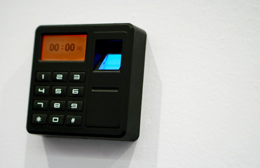 Closeup of bio metric finger print sensor equipment to control access or movement or attendance in places such as offices,hospitals        