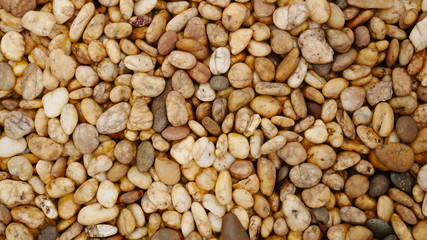 brown pebble stone background, stone texture