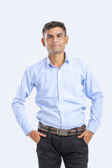 young indian man Standing over white background