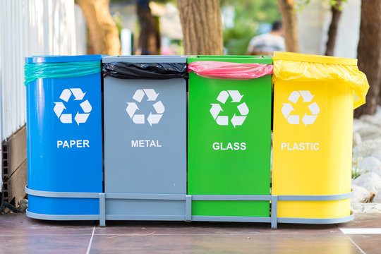 Selective collection of garbage colored containers with inscriptions for separate waste