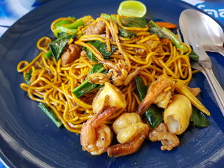 Stir fried yellow seafood with soy sauce