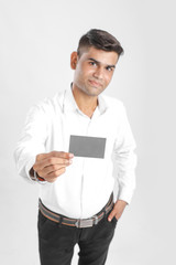 Yong Indian Man Showing Card