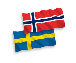 National vector fabric wave flags of Norway and Sweden isolated on white background. 1 to 2 proportion.