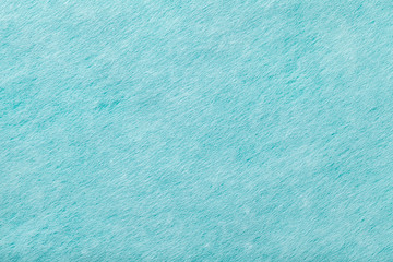 Light blue matt suede fabric closeup. Velvet texture of felt.