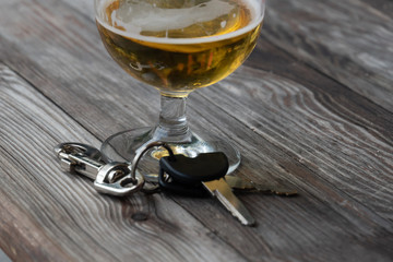 Drinking and driving - Vehicle keys near a glass beer