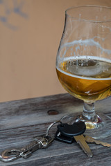 Drinking and driving - Vehicle keys near a glass beer