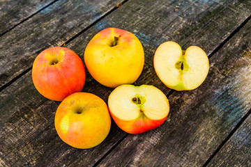 Naklejka na ściany i meble Pile of the ripe apples on wooden table