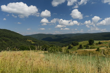 Amazing mountain landscape with blue sky with white clouds, natural outdoor travel background. Beauty world.