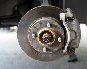 A front right wheel disc car brake suite.