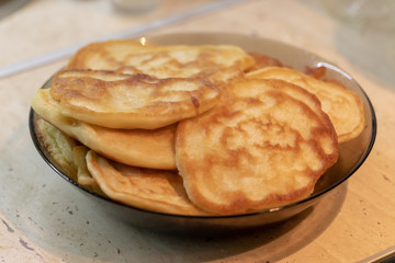 fresh pancakes on a glass dish. authentic homemade food. background backdrop.