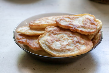 fresh pancakes on a glass dish. authentic homemade food. background backdrop.