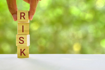 Financial risk assessment and portfolio risk management concept : Stack of vertical 4 cubes on a...