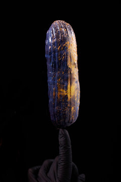 Beautiful bright eclair with blets on a dark background.