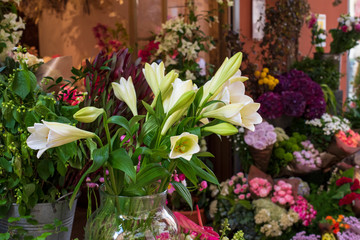 A variety of flowers on a street exhibition of flower shop, Italy.