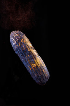 Beautiful bright eclair with blets on a dark background.