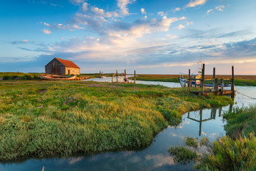 The picturesque old harbour at Thornham in Norfolk - obrazy, fototapety, plakaty