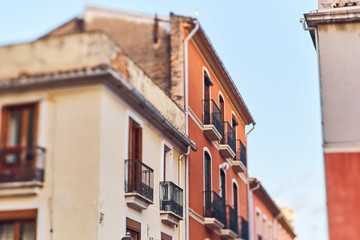 Fototapeta na wymiar DENIA, SPAIN - JUNE 19, 2019: Old town of Denia with narrow streets and coloured houses.