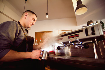 Barista hands making coffee cup with coffee machine in coffee shop