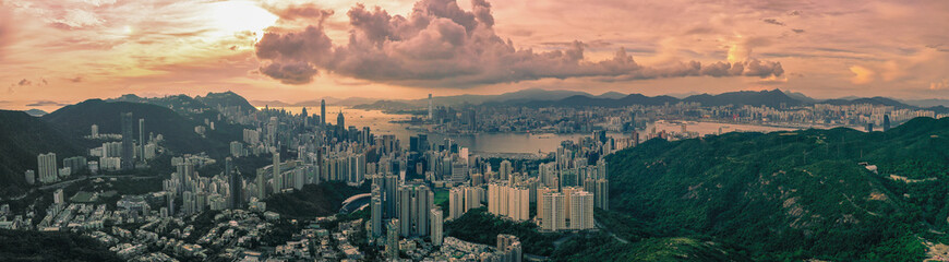 Panorama aerial view of Hong Kong City at sunset.