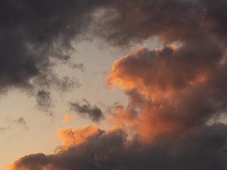 Fototapeta premium Beautiful dark clouds at sunset. The evening sky during sunset.