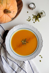 pumpkin soup puree on light background