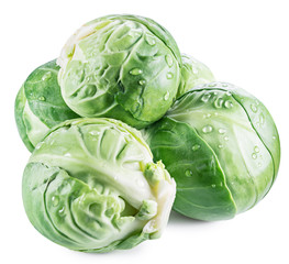 Green brussel sprouts with water drops on white background. Clipping path.