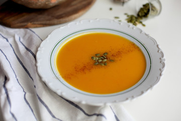 pumpkin soup puree on light background