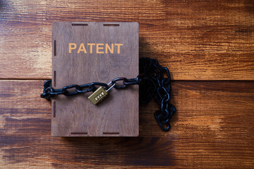 Concept for copyright, patent or intellectual property and idea protection.Box wrapped with chain...