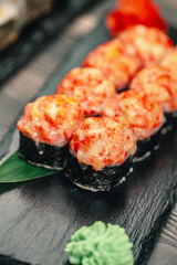 Healthy food. Japanese restaurant. Sushi roll on a black background