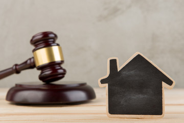 Real estate concept -auction gavel and little house with copy space
