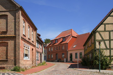 Historical architecture in a narrow alley of the holiday destination Plau on lake (Plau am See), Mecklenburg Lake Plateau, Germany
