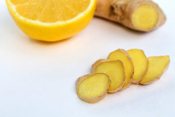 Fototapeta na wymiar slices of fresh ginger on white background