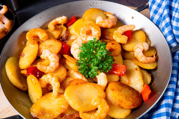 a delicious fried potato and shrimp pan