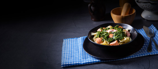 pappardelle pasta with creamed spinach and fried salmon