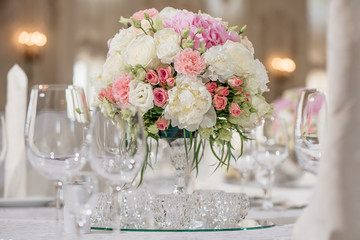 delicate bright flower arrangement at a wedding party