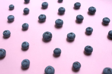 Blueberries pattern on pink background top view