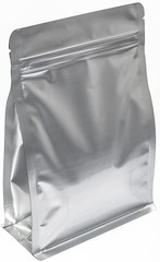 matt silver aluminium flat bottom food pouch  with zipper  filled with coffee beans on white...