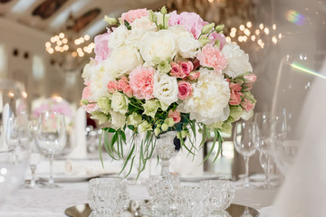 delicate bright flower arrangement at a wedding party