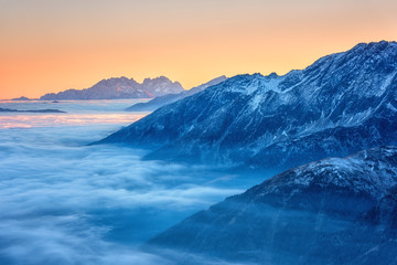 Amazing nature landscape, scenic panoramic top view of the Alps mountain range with clouds at sunset, outdoor travel background, Hohe Tauern national park, Carinthia, Austria