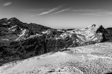 Amazing nature winter landscape, scenic panoramic top view of the Alps mountain range, outdoor travel background, Hohe Tauern national park, Carinthia, Austria, black and white image