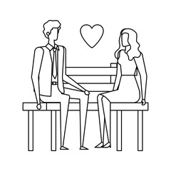 business couple lovers seated in the park chair with heart