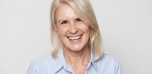 Beautiful senior woman is smiling. Isolated.