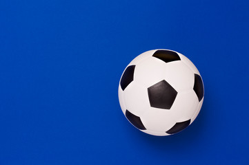 Fototapeta na wymiar Soccer ball or football on blue background