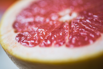 Grapefruit sliced half . Citrus fruit macro. Selective focus. Top view. Summer food concept.