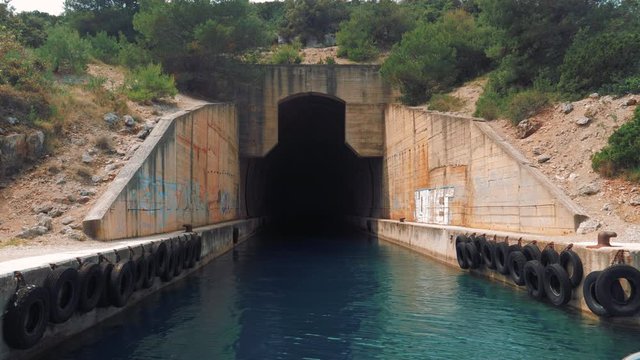 Close up shot of a submarine/military tunnel. Boat ride at Dugi Otok, Croatia.