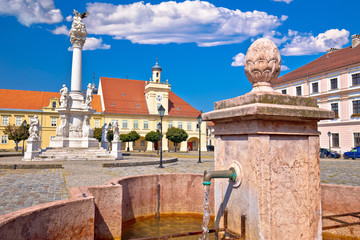 Fototapeta na wymiar Old paved street and fountain in Tvrdja historic town of Osijek