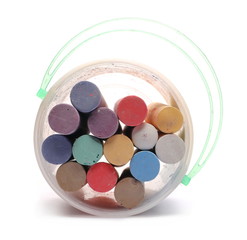 Colorful chalks in plastic bucket isolated on white background